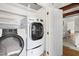 Well-lit laundry room equipped with a washer and dryer at 406 Johns Woods Rd, Chapel Hill, NC 27516