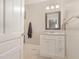 Well-lit bathroom with a vanity and mirror over a sink, complete with modern fixtures and a towel rack at 411 E Green St, Franklinton, NC 27525