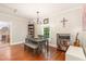 Cozy dining room featuring hardwood floors, a modern table set, and decorative lighting at 411 E Green St, Franklinton, NC 27525