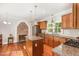 Well-equipped kitchen featuring granite countertops, stainless steel appliances, and ample cabinet space at 411 E Green St, Franklinton, NC 27525