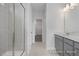 Bathroom with glass enclosed shower, tile floors, and double sink vanity at 422 Grading Stick Ct, Angier, NC 27501