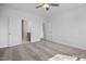 An expansive bedroom showcases neutral carpet, ceiling fan and several entry doors at 422 Grading Stick Ct, Angier, NC 27501