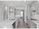 Modern kitchen featuring gray cabinets, granite countertops, and stainless steel appliances at 422 Grading Stick Ct, Angier, NC 27501