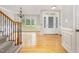 Bright foyer showcasing wood floors, an elegant chandelier, and detailed trim, creating a grand entrance at 50 Pebble Creek Dr, Franklinton, NC 27525