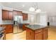 This updated kitchen features an island, stainless steel appliances, and ample cabinet space at 50 Pebble Creek Dr, Franklinton, NC 27525