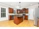 This updated kitchen features an island, stainless steel appliances, and ample cabinet space at 50 Pebble Creek Dr, Franklinton, NC 27525