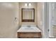 Powder room featuring contemporary vanity with sink and decorative mirror at 5121 Ten Point Trl, Wake Forest, NC 27587