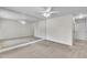 Spacious, carpeted bedroom with a mirrored wall and a ceiling fan at 5121 Ten Point Trl, Wake Forest, NC 27587