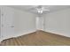 Bedroom with wood-look floors, a ceiling fan, and white trim at 5121 Ten Point Trl, Wake Forest, NC 27587