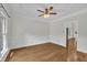 Spacious dining area featuring hardwood floors, classic trim, and a ceiling fan at 5121 Ten Point Trl, Wake Forest, NC 27587