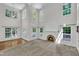 Bright, airy living room with high ceilings, fireplace, and many windows at 5121 Ten Point Trl, Wake Forest, NC 27587