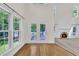 Bright living room featuring high ceilings, a fireplace, and natural light from windows at 5121 Ten Point Trl, Wake Forest, NC 27587