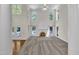 Bright living room with fireplace, large windows, and access to a deck at 5121 Ten Point Trl, Wake Forest, NC 27587