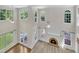 Stunning living room featuring a fireplace and many oversized windows for optimal lighting at 5121 Ten Point Trl, Wake Forest, NC 27587