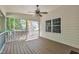 Screened in back porch with ceiling fan and beautiful views of the yard at 5121 Ten Point Trl, Wake Forest, NC 27587