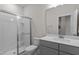 Bathroom featuring glass-enclosed shower, quartz countertop vanity, and modern fixtures at 518 Toran Dr, Wake Forest, NC 27587