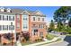 Exterior shot of a townhome with a brick facade and neat landscaping at 518 Toran Dr, Wake Forest, NC 27587