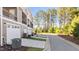 Side exterior view of townhomes showing garages and green spaces at 518 Toran Dr, Wake Forest, NC 27587