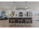 Modern kitchen with white cabinets, stainless appliances and an oversized central island with seating at 518 Toran Dr, Wake Forest, NC 27587