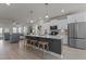 Bright kitchen with an island and bar stool seating, and stainless steel appliances at 518 Toran Dr, Wake Forest, NC 27587