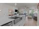 Spacious modern kitchen with a stainless steel farmhouse sink and bright, open layout at 518 Toran Dr, Wake Forest, NC 27587