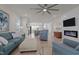 Inviting living room with hardwood floors, comfortable seating, and a modern fireplace feature at 518 Toran Dr, Wake Forest, NC 27587