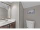 Modern half bathroom with a new vanity and fixture and cute map art at 5301 Northpines Dr, Raleigh, NC 27610