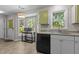 Bright kitchen area features granite countertops, stainless steel appliances, and a sunlit breakfast nook at 5301 Northpines Dr, Raleigh, NC 27610