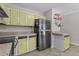 Functional kitchen featuring a stainless steel refrigerator and plenty of counter space for food preparation at 5301 Northpines Dr, Raleigh, NC 27610