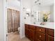 Bathroom featuring a single sink vanity, neutral colored walls, and shower with curtain at 5708 Big Sandy Dr, Raleigh, NC 27616
