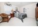Cozy bedroom with neutral walls, comfy bedding, and a matching wooden dresser at 5708 Big Sandy Dr, Raleigh, NC 27616