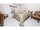 Bedroom with neutral walls, large window and a cozy bed with decorative pillows at 5708 Big Sandy Dr, Raleigh, NC 27616