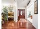 Welcoming foyer with hardwood floors, decorative rug, and views into adjacent living spaces at 5708 Big Sandy Dr, Raleigh, NC 27616