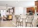 Open-concept kitchen with breakfast bar, stainless steel appliances, and adjacent dining area at 5708 Big Sandy Dr, Raleigh, NC 27616