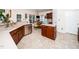 Well-equipped kitchen with stainless appliances, center island, and adjacent dining space at 5708 Big Sandy Dr, Raleigh, NC 27616