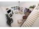 Aerial view of living room with vaulted ceilings, fireplace, and staircase leading to the upper level at 5708 Big Sandy Dr, Raleigh, NC 27616
