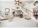 Spacious living area with comfortable seating, barstools, and a staircase leading to the second floor at 5708 Big Sandy Dr, Raleigh, NC 27616