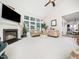 Bright living room featuring a fireplace, plush seating, and large windows for natural light at 5708 Big Sandy Dr, Raleigh, NC 27616