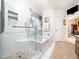 Spa-like main bathroom with a glass-enclosed shower, soaking tub, and modern fixtures at 5708 Big Sandy Dr, Raleigh, NC 27616