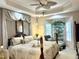 Inviting main bedroom with tray ceilings, sitting area, and serene ambiance at 5708 Big Sandy Dr, Raleigh, NC 27616