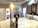 Luxurious main bedroom featuring a fireplace and ensuite bathroom at 5708 Big Sandy Dr, Raleigh, NC 27616