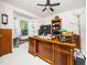 Bright home office with a large wooden desk, ample natural light, and built-in shelving at 5708 Big Sandy Dr, Raleigh, NC 27616
