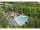 Aerial view of neighborhood pool with clubhouse, playground, and parking at 5708 Big Sandy Dr, Raleigh, NC 27616