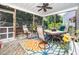 Relaxing screened in porch with ceiling fan and outdoor dining set at 5708 Big Sandy Dr, Raleigh, NC 27616