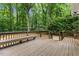 A back deck features steps and overlooks the backyard at 702 Sanderson Dr, Durham, NC 27704