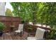 Outdoor deck space with seating offering a view of the surrounding greenery at 7244 Galon Glen Rd, Raleigh, NC 27613