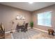Bright office space featuring a desk, chair, and window with blinds at 7244 Galon Glen Rd, Raleigh, NC 27613