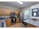 Bright kitchen featuring stainless steel appliances and light wood cabinetry at 7244 Galon Glen Rd, Raleigh, NC 27613