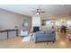 Well-lit living area with a fireplace, stylish furniture, and open concept dining at 7244 Galon Glen Rd, Raleigh, NC 27613
