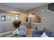 Bright living room with view into dining area, offering lots of natural light at 7244 Galon Glen Rd, Raleigh, NC 27613